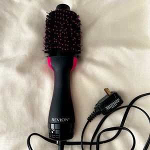 Black with pink Revlon hair dryer brush
